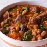 A bowl of a hearty chicken sausage white bean soup.