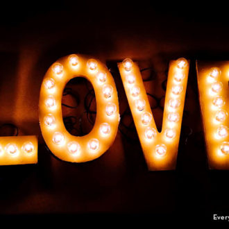 A DIY marquee sign that says LOVE — great for a bridal shower or home decor.