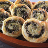 A batch of savory mushroom pinwheels — a restaurant-quality appetizer for your next party.