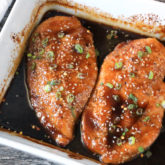 A dish with sesame garlic chicken, cooked and ready to serve for dinner.