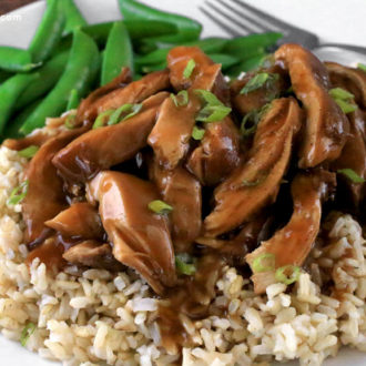 Slow cooker chicken teriyaki, served on a bed of rice — a perfect dinner.