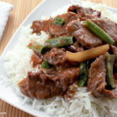 A plate of delicious Mongolian beef that was made in a slow cooker.