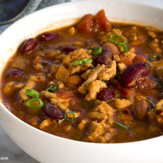 A steamy bowl of turkey chili that's ready to eat.