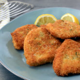 A plate of delicious breaded crispy chicken cutlets, perfect for lunch or dinner!