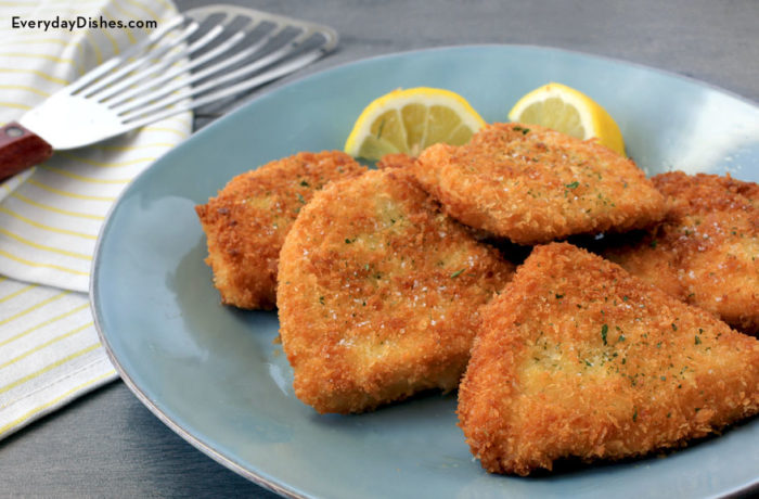 A plate of delicious breaded crispy chicken cutlets, perfect for lunch or dinner!
