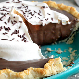 Chocolate cream pie with a slice taken out. A delicious and easy dessert.