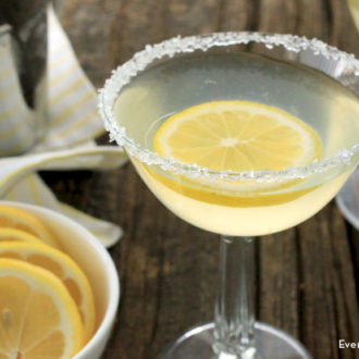 Two delicious lemon meringue martinis garnished with lemon slices.