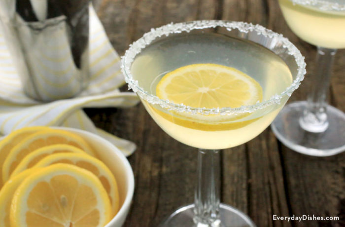 Two delicious lemon meringue martinis garnished with lemon slices.