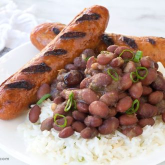 A plate of red beans and rice that's ready to enjoy for dinner.
