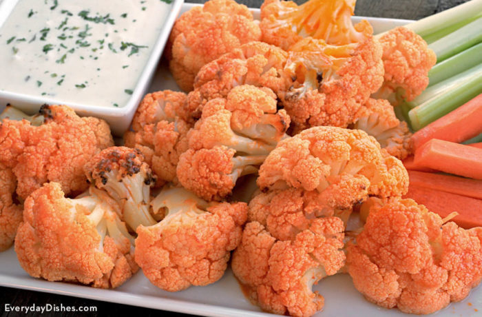 A batch of buffalo-flavored cauliflower with a side of ranch.