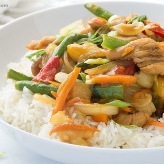 A bowl full of an easy-to=make chicken teriyaki served on rice and ready for dinner.
