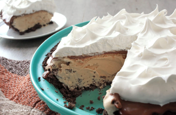 A homemade frozen mocha pie with a slice taken out of it.