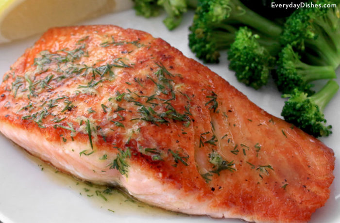 Pan-seared salmon dill butter, on a plate and ready to enjoy for dinner.