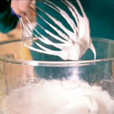 Someone in the process of making the perfect meringue.