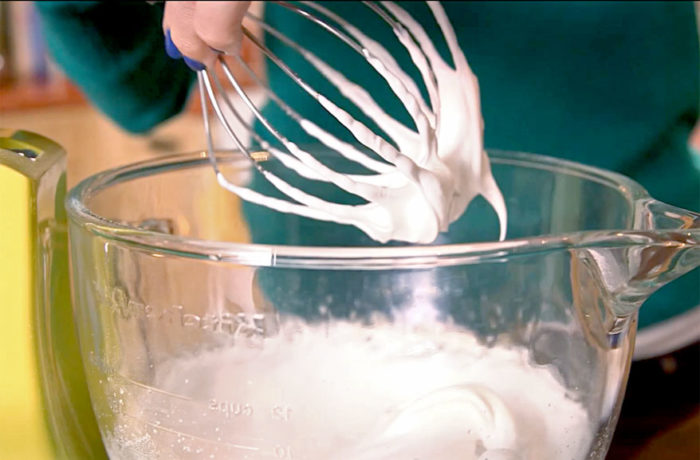 Someone in the process of making the perfect meringue.