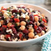 A bowl with a mixed bean salad, ready to serve.