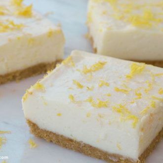 A batch of no-bake lemon bars sliced into pieces and ready to serve.
