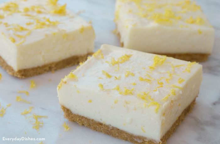 A batch of no-bake lemon bars sliced into pieces and ready to serve.
