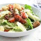 A bowl of a delicious BLT Caesar salad.