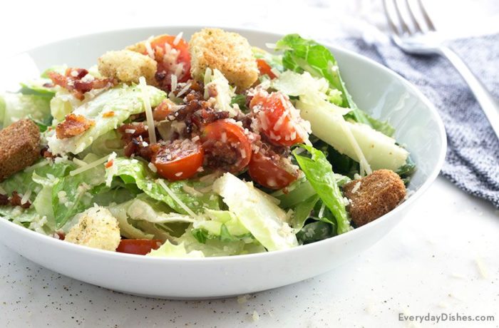 A bowl of a delicious BLT Caesar salad.