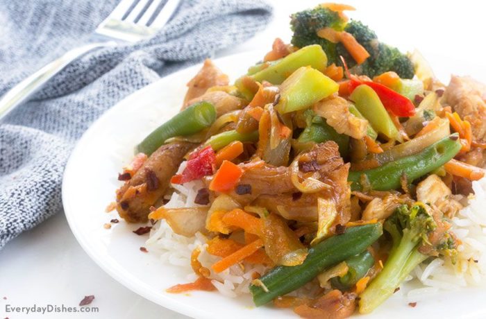 A plate of some delicious chicken teriyaki stir fry.
