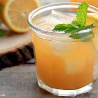 A refreshing glass of peach lemonade.