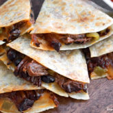 A plate of some delicious slow cooker beef quesadillas.
