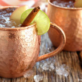 Two mugs with an angry mule cocktail, a twist on a classic drink.