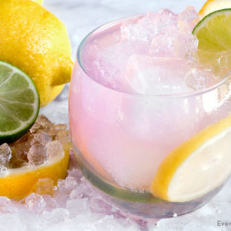 A glass of a refreshing pink lemonade vodka punch