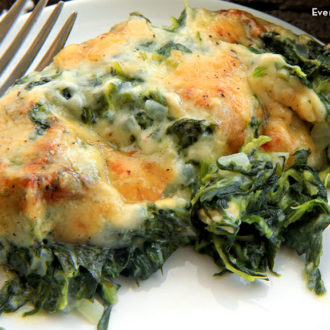 A serving of spinach gratin on a plate.