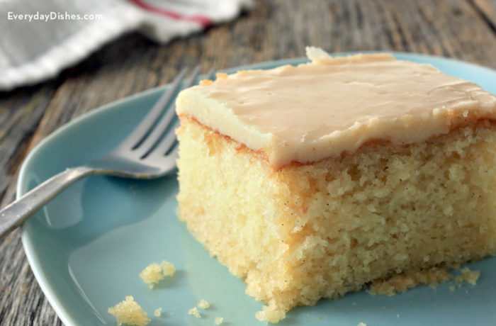 A slice of delicious vanilla cake with brown butter glaze.