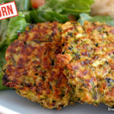 Some baked zucchini einkorn fritters, on a plate and ready to eat for dinner.