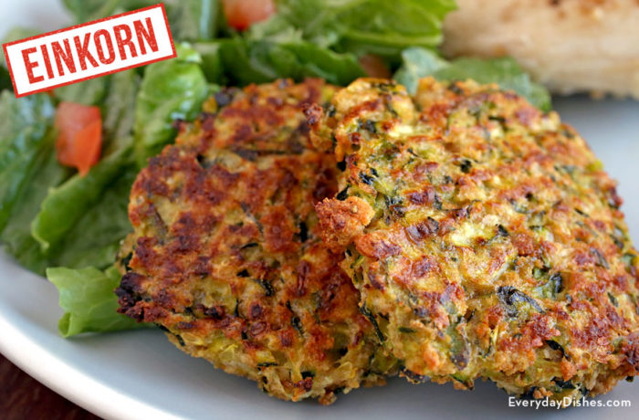Some baked zucchini einkorn fritters, on a plate and ready to eat for dinner.