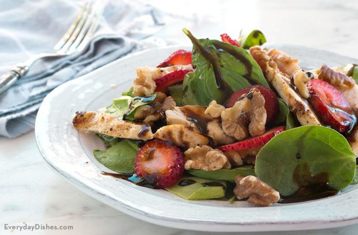 A delicious balsamic strawberry chicken salad on a plate and ready to eat.