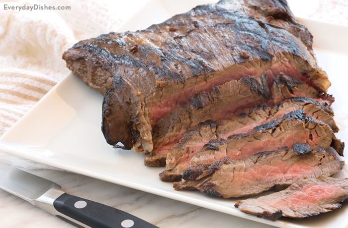 A freshly grilled, soy-marinated flank steak, sliced and ready to enjoy for dinner.