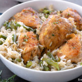 A bowl of a delicious lemon chicken and rice, ready to enjoy for dinner.