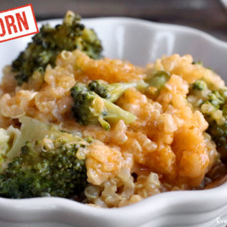 A bowl full of einkorn cheesy quinoa and broccoli, the perfect side dish.