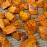 A batch of delicious maple-roasted sweet potatoes for a Thanksgiving side dish recipe or for any time of the year.