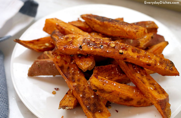 A plate with some delicious homemade baked sweet potato fries.