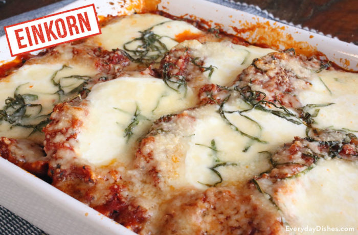 A dish of homemade einkorn chicken parmesan that is ready to serve for dinner.