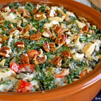Leftover turkey casserole with kale and wild rice in a dish and ready to eat for dinner.