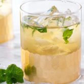 A delicious mojito made with sparkling champagne, served in a glass and ready to drink.