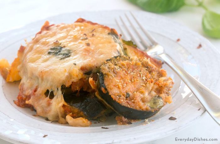 A plate with a delicious serving of baked eggplant parmesan.
