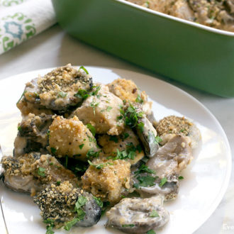 A delicious mushroom chicken gouda bake, on a plate to enjoy for dinner.