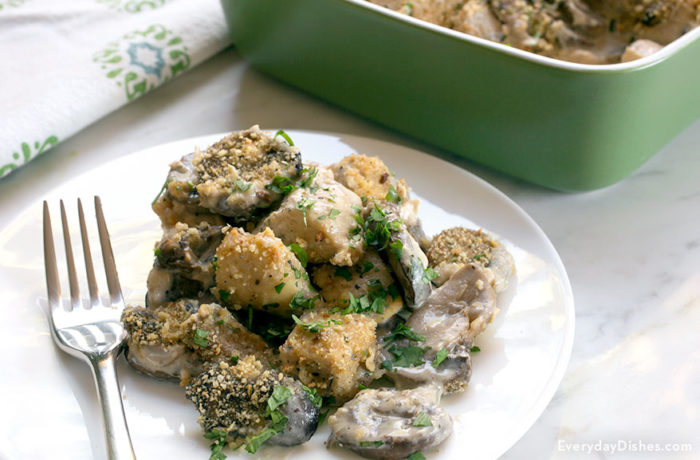 A delicious mushroom chicken gouda bake, on a plate to enjoy for dinner.