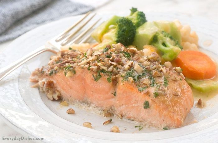 A slice of pecan-crusted honey mustard salmon on the table for dinner