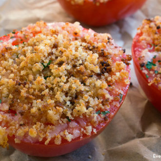 Two tomato halves dusted with homemade breadcrumbs.