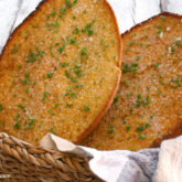 Homemade garlic bread in a basket.
