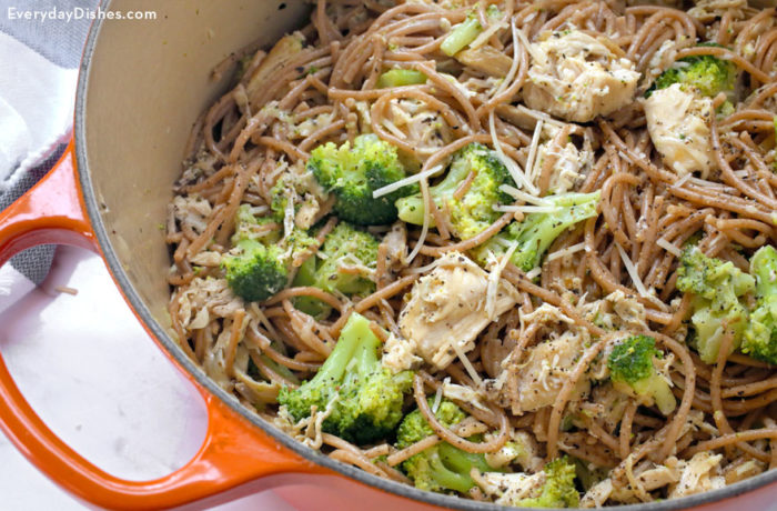 A skillet full of leftover chicken and broccoli pasta