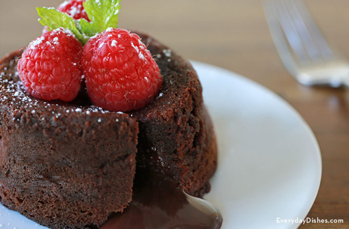 A delicious molten lava cake that's garnished with raspberries, perfect for Valentine's Day